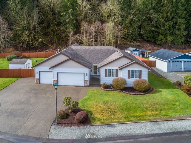 a front view of a house with yard