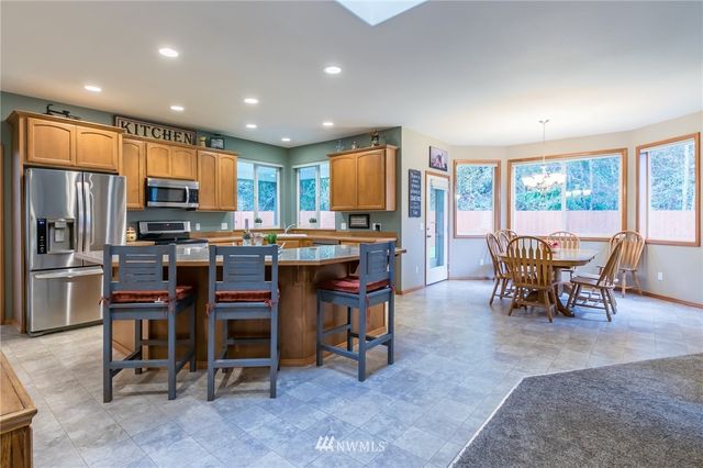 a view of a dining room with furniture window and outside view