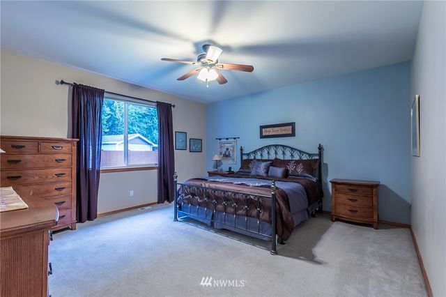 a bed room with a bed and a window