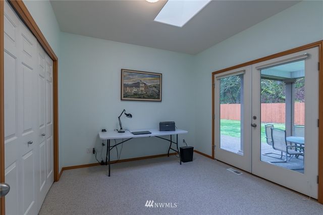 a bed room with a bed and a window