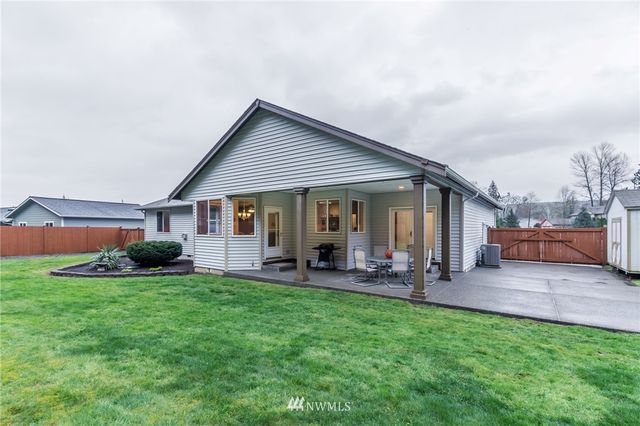 a front view of a house with garden and porch