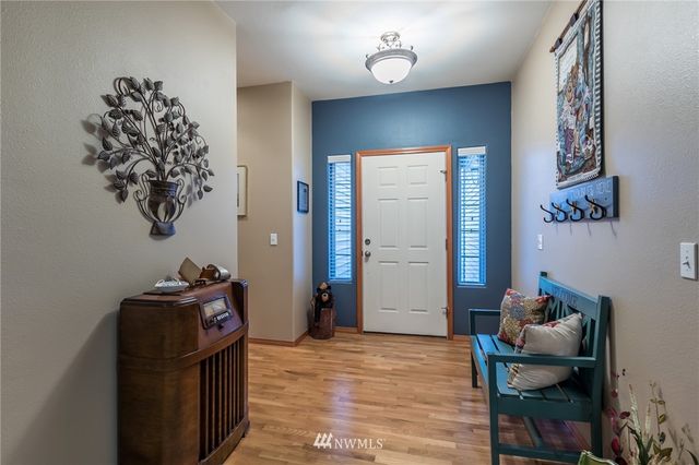 a bedroom with a bed and a chair