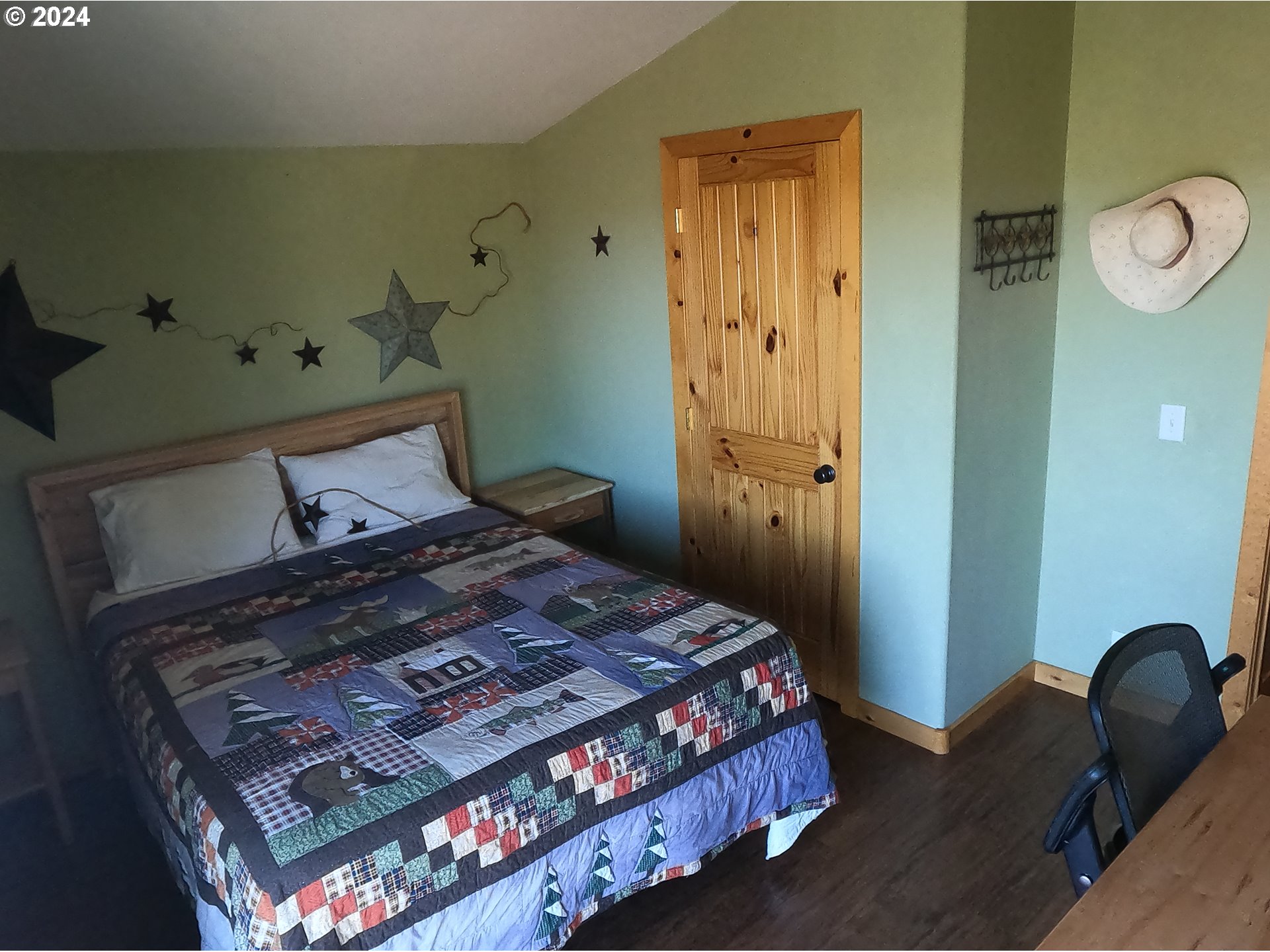 11175 Southwest Pixie Lane Culver, OR 97734 - Photo 14 of 33 a bedroom with a bed and chair