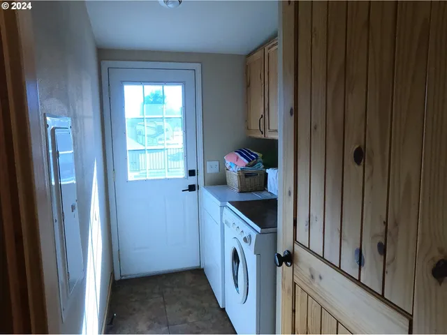 a roof deck with table and chairs a barbeque