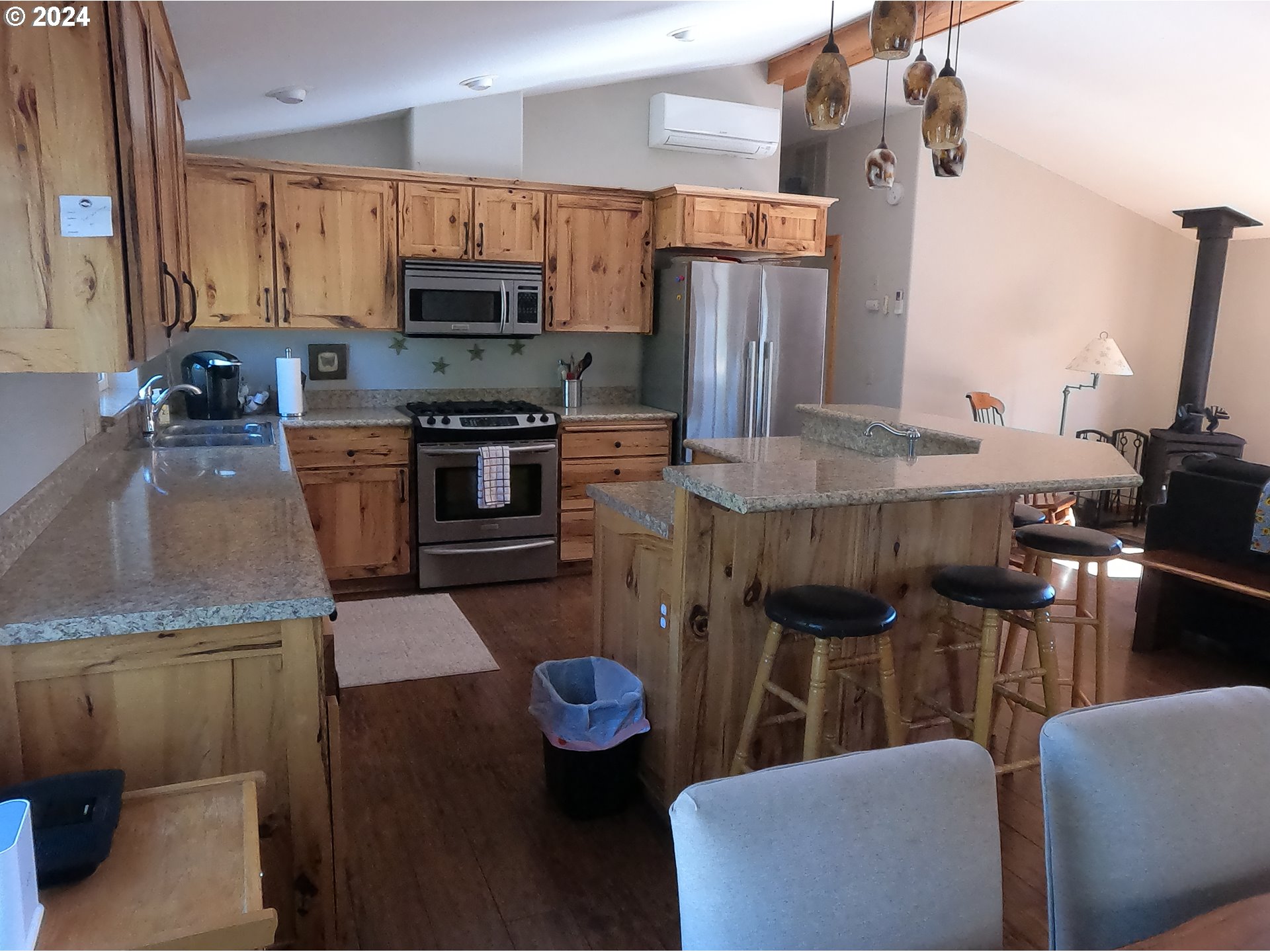 11175 Southwest Pixie Lane Culver, OR 97734 - Photo 5 of 33 a kitchen with stainless steel appliances granite countertop a sink refrigerator and microwave