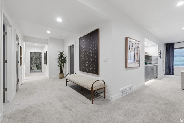 2559 West Aurora Avenue Mapleton, UT 84664 - Photo 46 of 60 Long hallway featuring light-toned carpet flooring, recessed lighting, and white baseboards