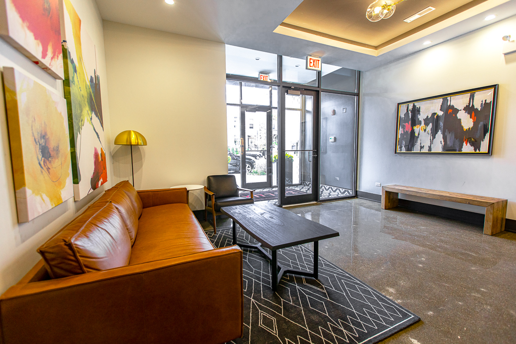 Undisclosed Address Chicago, IL 60640 - Photo 18 of 29 a living room with furniture a window and a flat screen tv