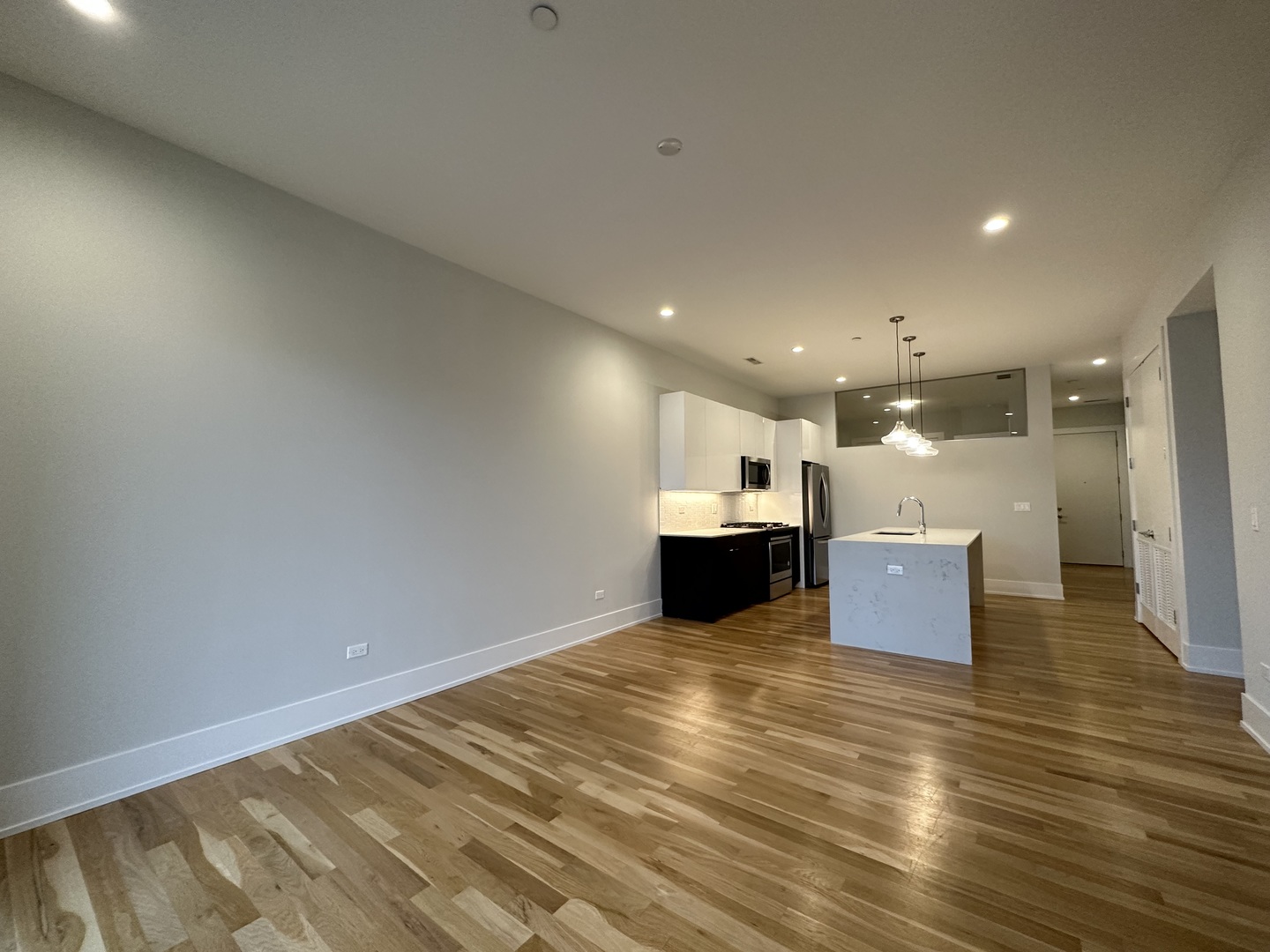 Undisclosed Address Chicago, IL 60640 - Photo 4 of 29 a view of kitchen and kitchen with stainless steel appliances
