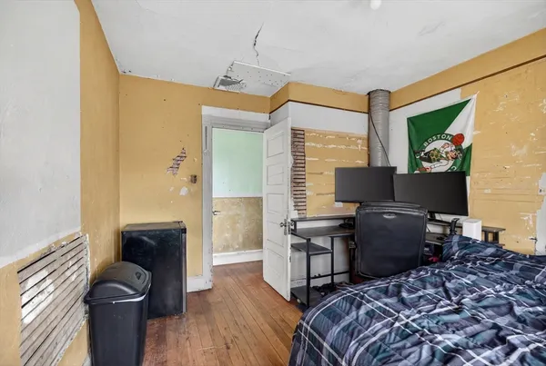 a bedroom with a bed and furniture