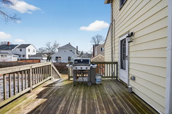a view of a yard covered with snow in front of house