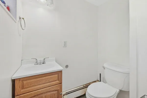 a bathroom with a sink toilet and vanity