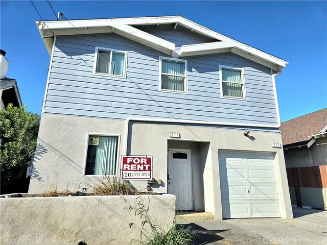 a front view of a house with a garage