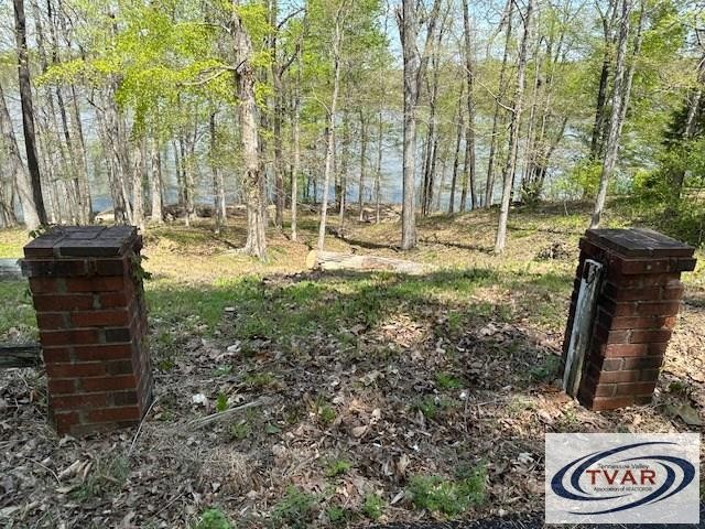 844 Stirling Road Camden, TN 38320 - Photo 13 of 29 a backyard of a house with lots of green space
