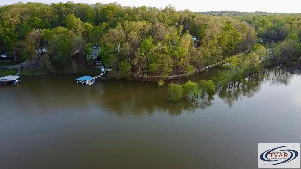 844 Stirling Road Camden, TN 38320 - Photo 3 of 29 an aerial view of residential houses with outdoor space and trees