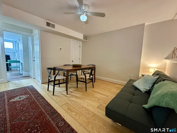 a workspace with furniture and wooden floor