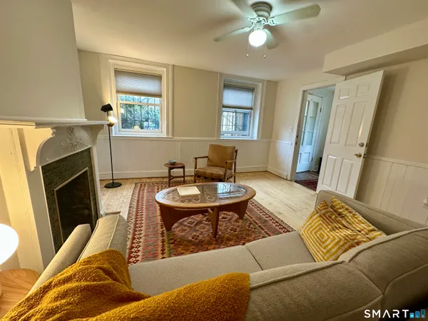 a living room with furniture and a fireplace