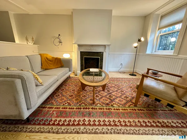 a living room with a rug