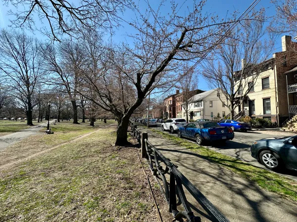 a view of a house with a yard covered in snow