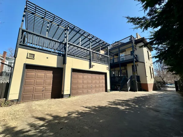a view of a house with a snow on the road