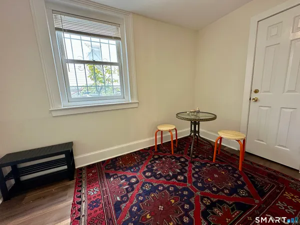 a workspace room with furniture and a window