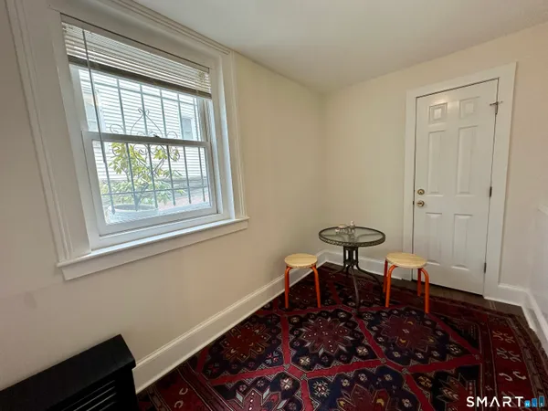a view of a room with a table and chair