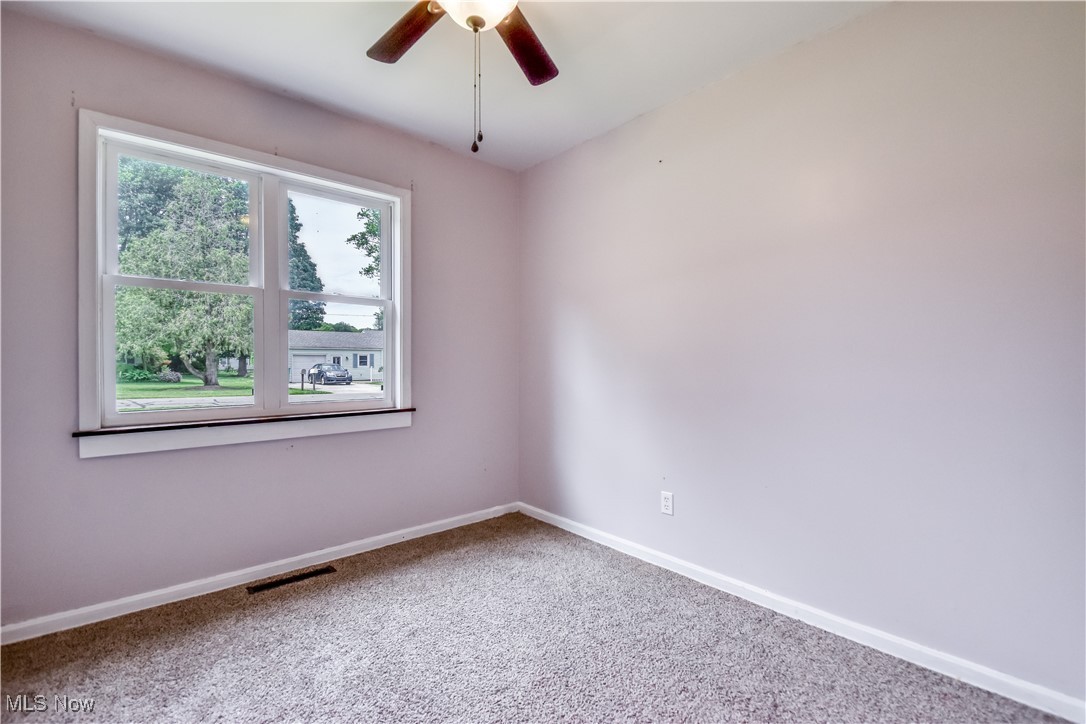 1919 Sandgate Road Madison, OH 44057 - Photo 12 of 28 Spare room with carpet floors and a ceiling fan