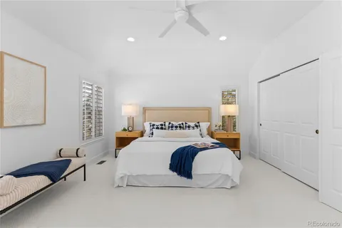 a bedroom with a bed and a couch