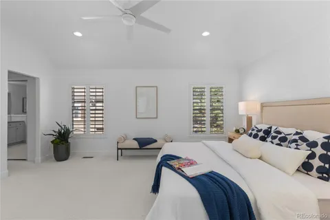 a bedroom with furniture and a window