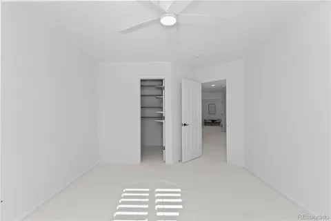 a view of room with walk in closet and window