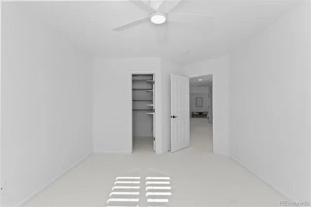 a view of room with walk in closet and window