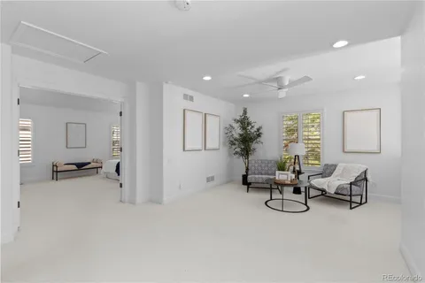 a view of a livingroom with furniture and windows