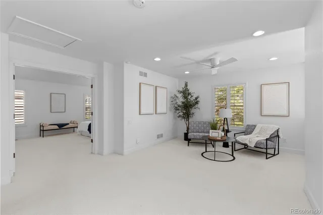 a view of a livingroom with furniture and windows