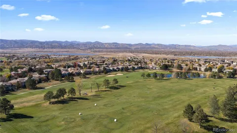 a view of a city with mountains in the background