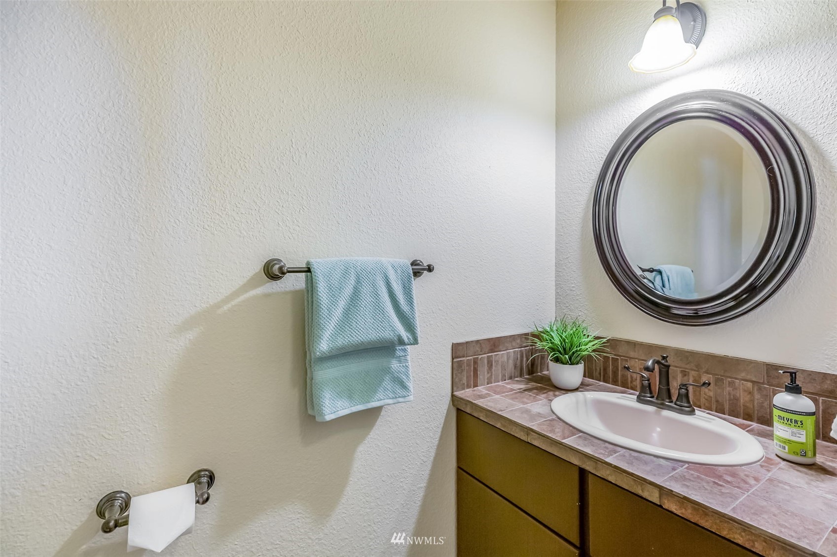 924 Goat Trail Loop Road Mukilteo, WA 98275 - Photo 17 of 40 a bathroom with a granite countertop sink and a mirror