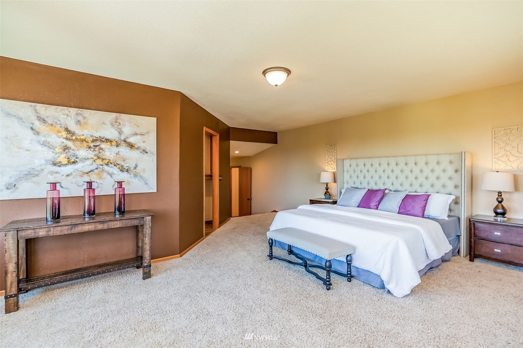 924 Goat Trail Loop Road Mukilteo, WA 98275 - Photo 19 of 40 a spacious bedroom with a bed and a flat screen tv