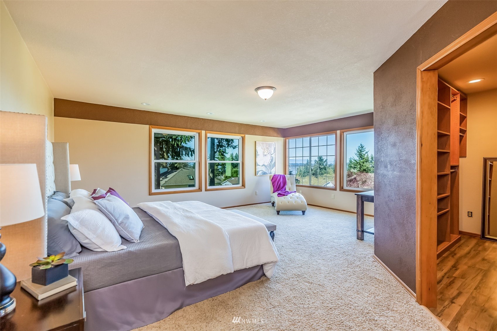 924 Goat Trail Loop Road Mukilteo, WA 98275 - Photo 21 of 40 a spacious bedroom with a bed and a large window