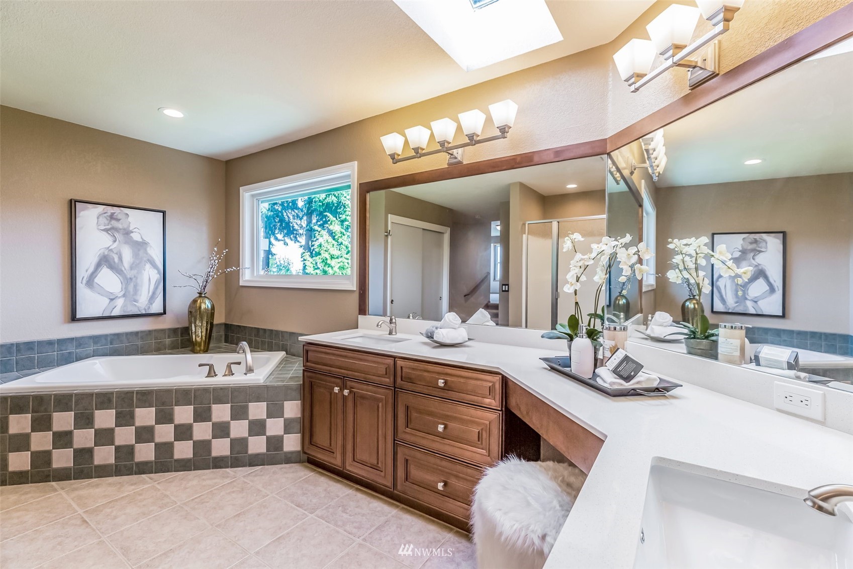 924 Goat Trail Loop Road Mukilteo, WA 98275 - Photo 25 of 40 a bathroom with a double vanity sink a mirror and a bathtub