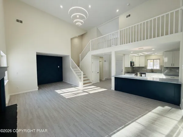 a kitchen with a refrigerator and a sink
