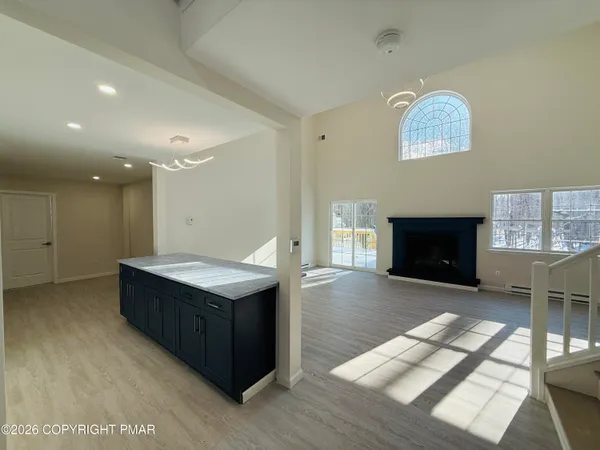 a kitchen with a cabinets and a fireplace