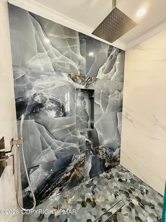 a room with water heater and wooden walls