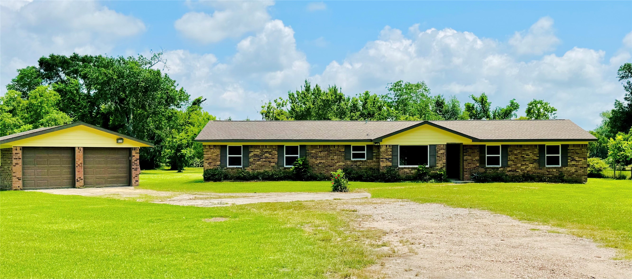 1434 County Road 878A Sweeny, TX 77480 - Photo 3 of 36 a front view of a house with yard and green space