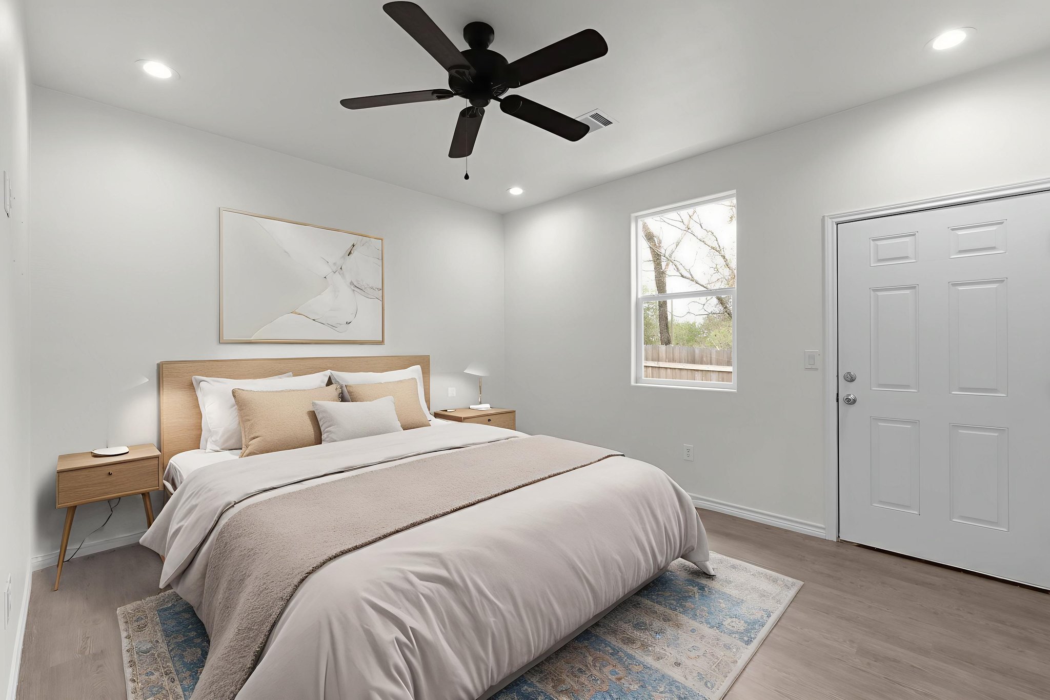 870 Waco Street Kingsland, TX 78639 - Photo 12 of 30 a bedroom with a large bed and a window