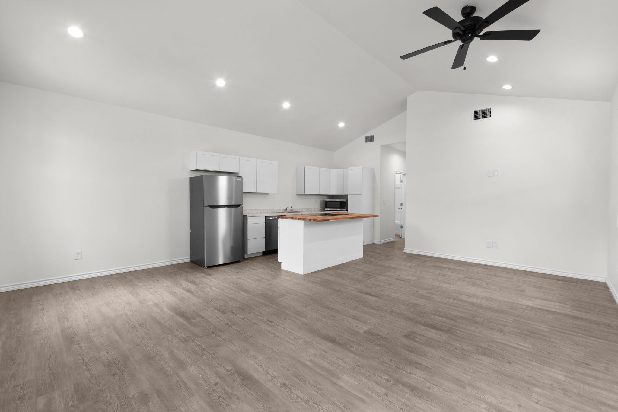 870 Waco Street Kingsland, TX 78639 - Photo 29 of 30 a view of kitchen with stainless steel appliances a refrigerator and a microwave