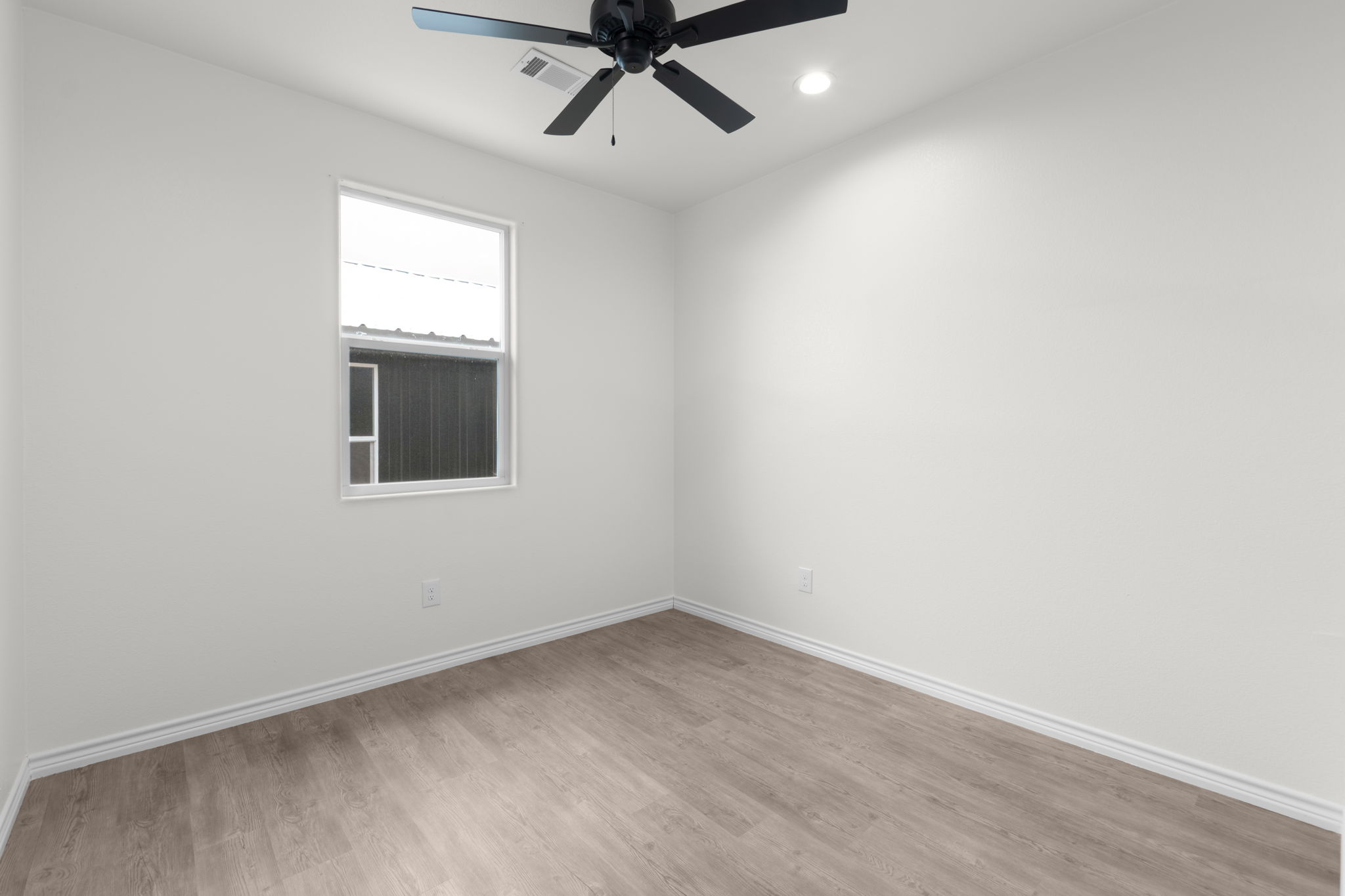870 Waco Street Kingsland, TX 78639 - Photo 18 of 30 an empty room with a window