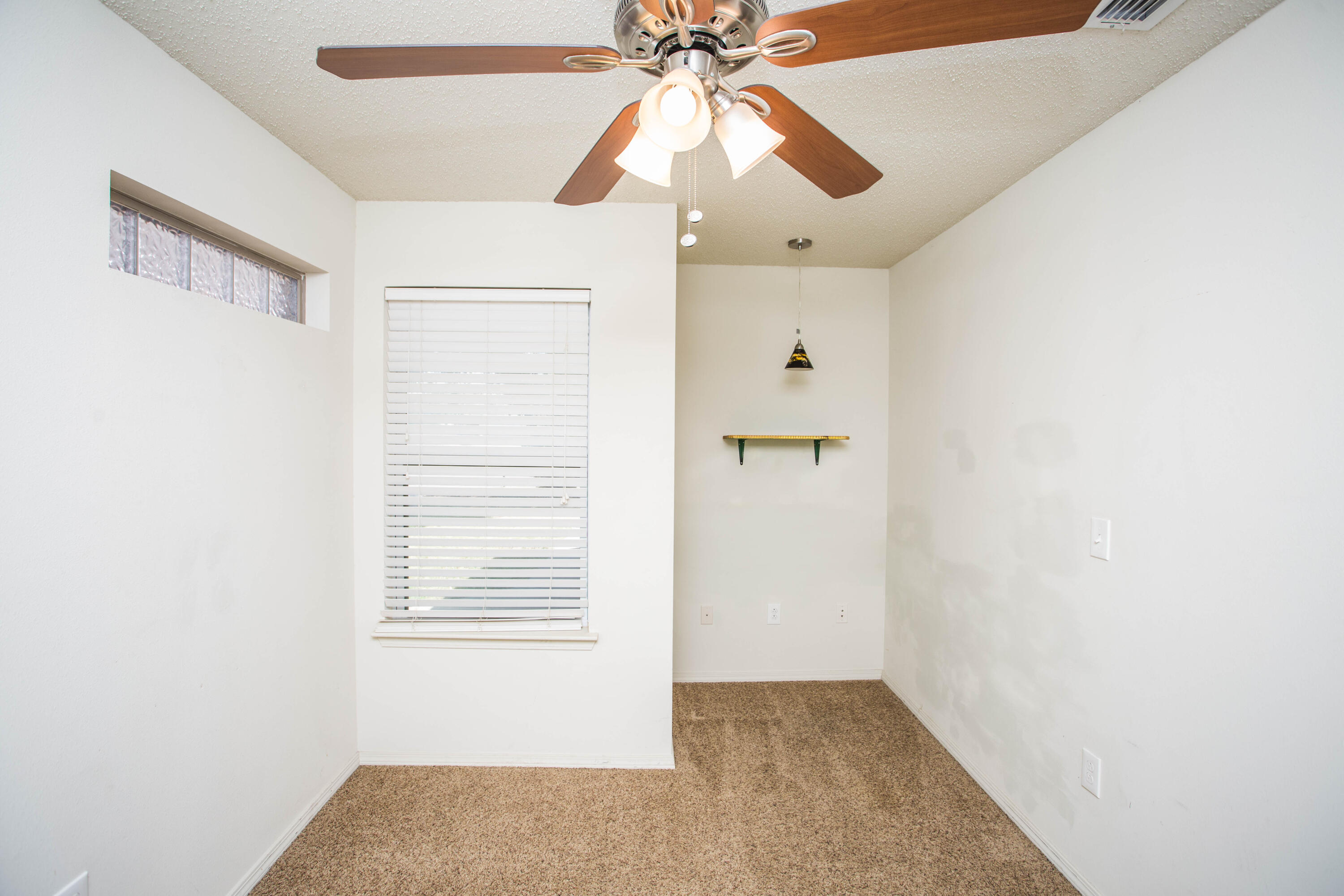 6114 22nd Street, Unit 2 Lubbock, TX 79407 - Photo 23 of 48 an empty room with windows and fan