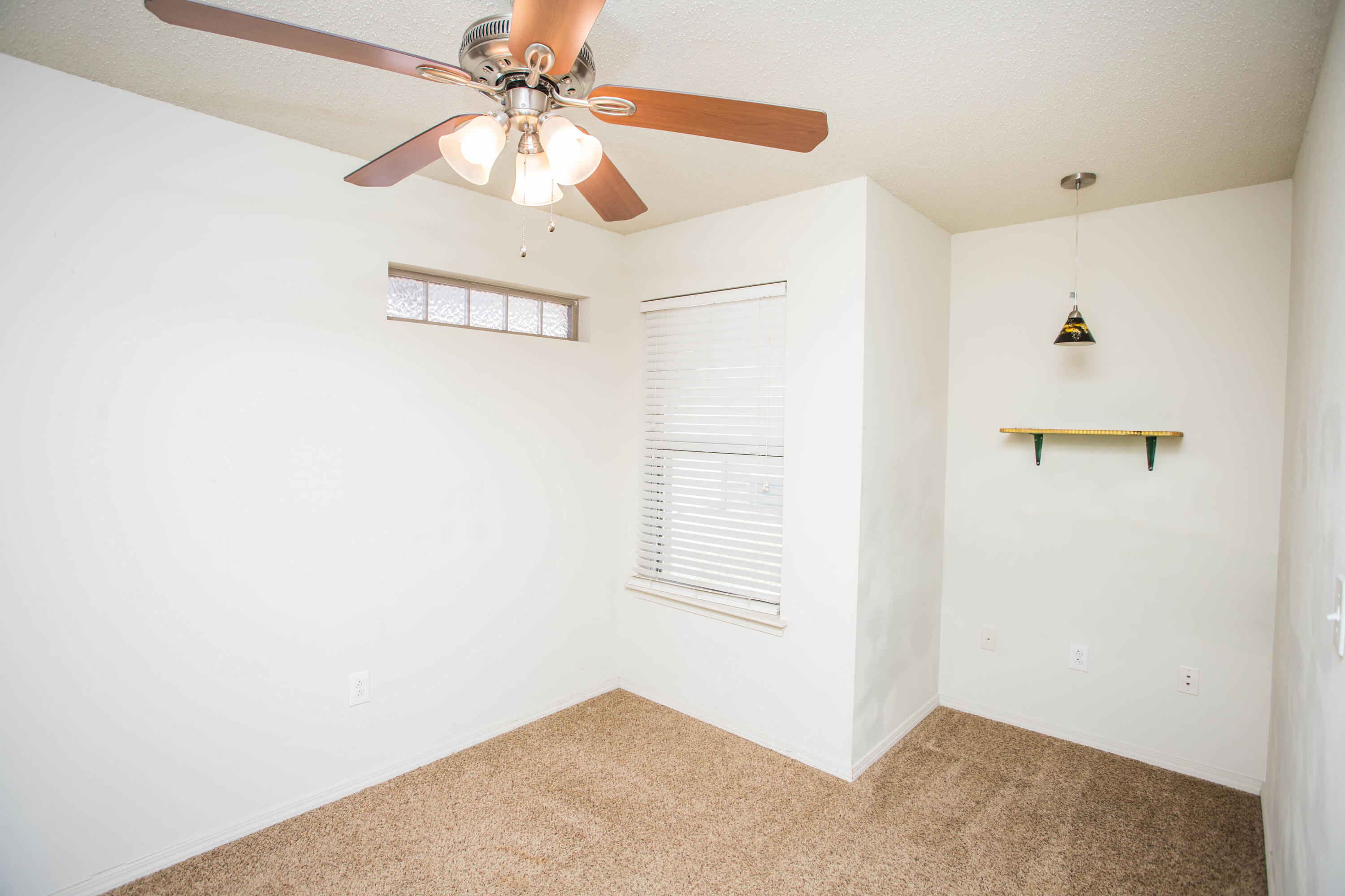 6114 22nd Street, Unit 2 Lubbock, TX 79407 - Photo 25 of 48 a view of a hallway with a fan