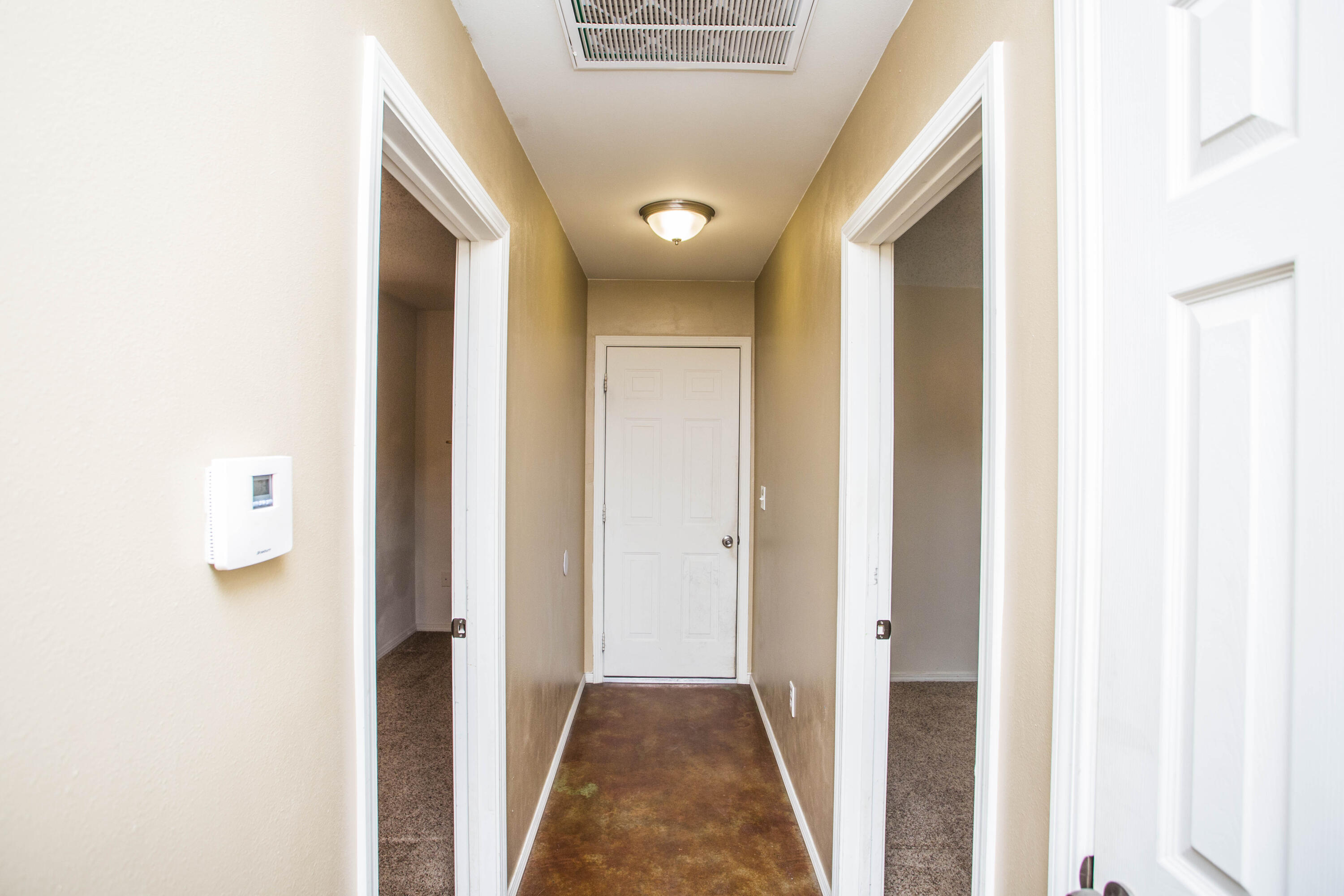 6114 22nd Street, Unit 2 Lubbock, TX 79407 - Photo 26 of 48 a view of a hallway with closet