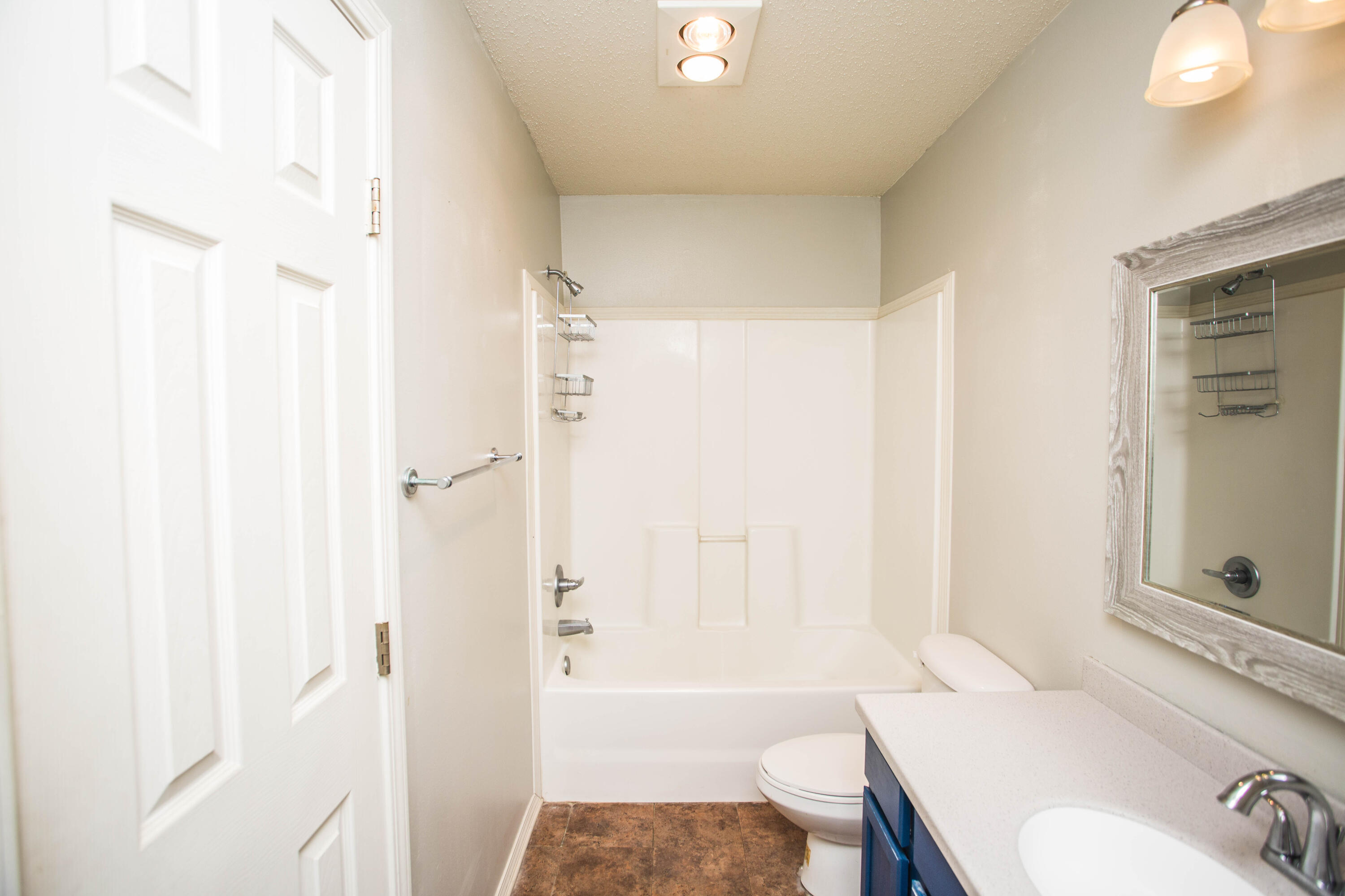 6114 22nd Street, Unit 2 Lubbock, TX 79407 - Photo 27 of 48 a bathroom with a sink toilet and shower