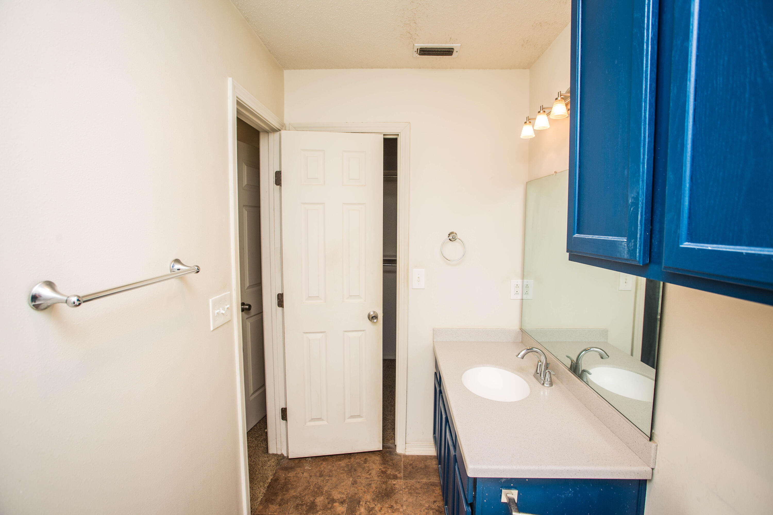 6114 22nd Street, Unit 2 Lubbock, TX 79407 - Photo 31 of 48 a bathroom with a sink and a mirror