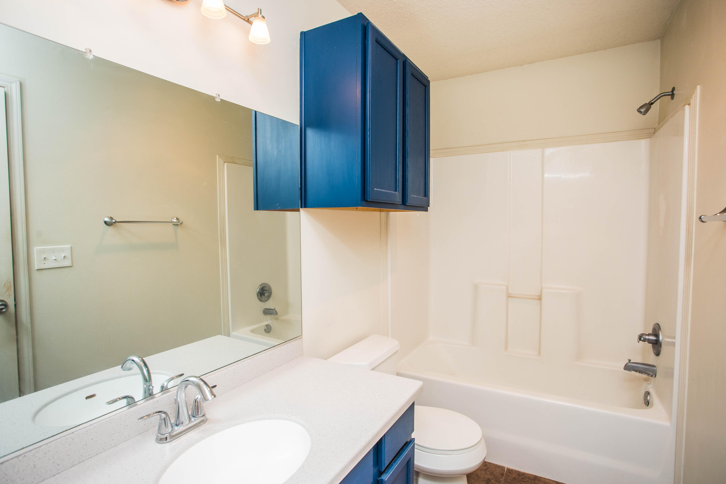6114 22nd Street, Unit 2 Lubbock, TX 79407 - Photo 34 of 48 a bathroom with a sink toilet and shower